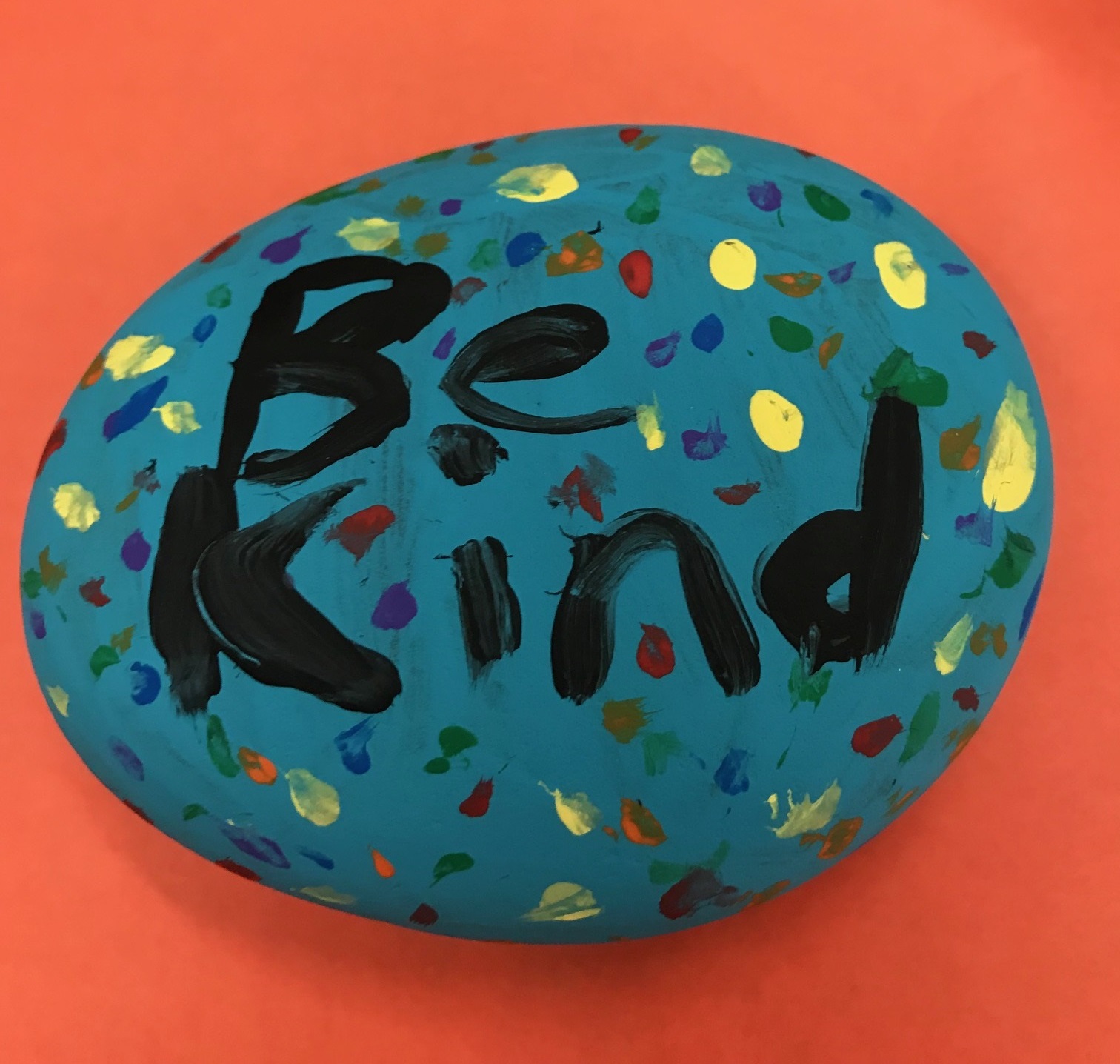 "Be Kind" Painted on a Stone