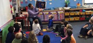 Mr. LaCoste Shares the Book "We're All Wonders" with Students