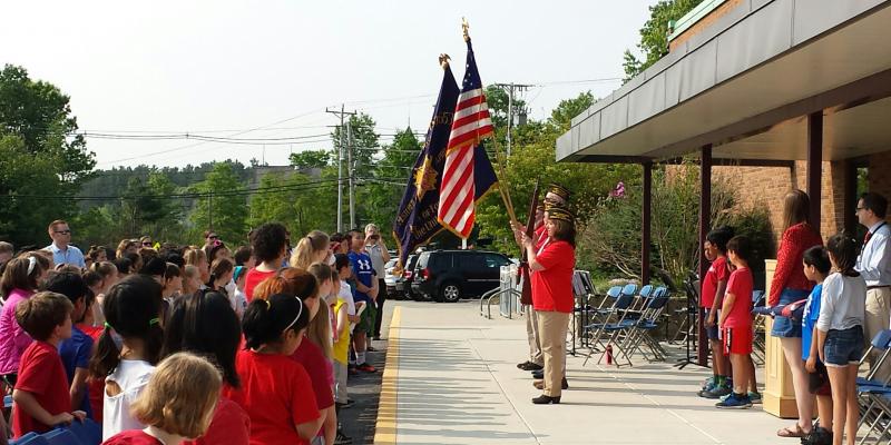 Color guard advancing the colors at the Day School Memorial Day program.