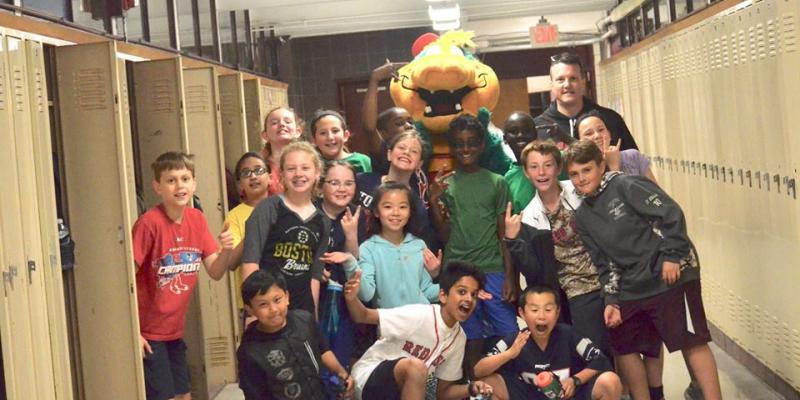 Mr. Whittlesey and his students posing with a Field Day mascot.
