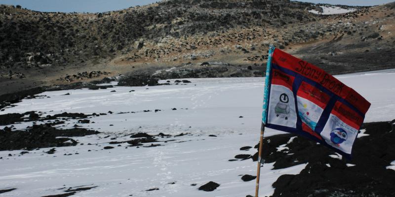 An SB Flag created by 2018 Gr6 students with all of their names flying in Antarctica at a research facility.